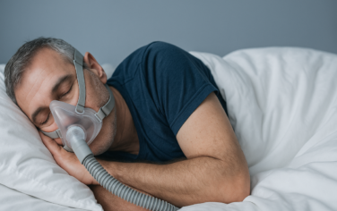 Picture of a man wearing a sleep apnea mask
